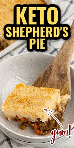 a close up of a piece of cake on a plate with a wooden spatula