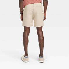 Elevate your casual ensembles effortlessly with these 7-Inch Regular-Fit Tech Pull-On Shorts from Goodfellow & Co™. These regular-fit shorts made from midweight woven fabric with four-way stretch make a comfy staple for everyday wear. Hitting above the knee, they're designed in a light taupe shade for easy coordination with a variety of casual looks. The front drawstring fastening offers a secure fit, while the side pockets and a back patch pocket provide space for your everyday essentials. Good Casual Pull-on Style Shorts, Casual Solid Color Pull-on Shorts, Fitted Leisure Pants For Summer, Casual Summer Bottoms With Comfort Waistband, Summer Leisure Fitted Pants, Casual Shorts With Short Inseam For Leisure, Relaxed Fit Bottoms With Short Inseam For Leisure, Leisure Bottoms With Relaxed Fit And Short Inseam, Casual Relaxed Fit Shorts With Short Inseam