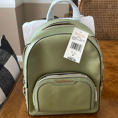 Nwt Michael Kors 35s2g8tb2l Jaycee Medium Pebbled Leather Backpack In Light Sage. Gold-Tone Hardware 8.75”W X 12”H X 4.25”D Exterior Details: Front Zip Pocket Interior Details: Back Zip Pocket, Tech Compartment, Front Slip Pocket Lining: 100% Polyester Zip Fastening Backpack Pebbled Leather 100% Leather Trim: 60% Polyurethane /20% Polyester/20% Cotton Pebbled Leather And Gilded Accents Come Together On Our Jaycee Backpacka Timeless Essential That’s Destined To Become Your New Hands-Free Favorite Green Backpack With Removable Pouch For Errands, Green Soft Leather Travel Backpack, Michael Kors Rhea Backpack, Messenger Backpack, Studded Backpack, Michael Kors Backpack, Red Backpack, Exterior Details, Sage Color