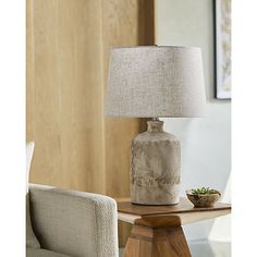 Incorporate unique texture and neutral hues into your space with this Neutral Textured Ceramic Rivera Table Lamp! This eye-catching table lamp is sure to bring a refined, sophisticated touch to your home. Lamp measures 25H in. Crafted of ceramic Textured finish Neutral hues Jug body Softback tapered shade in neutral linen Shade measures 10H x 15 in. in diameter at widest Socket accommodates a 150-watt, three-way bulb Includes a clear, 6 ft. plug-in cord Weight: 6.6 lbs. Care: Dust with a soft, dry cloth. Do not exceed specified wattage. This item is available at Kirklands.com only, not available in stores. Please note: this item cannot be shipped to APO/FPO addresses. | Neutral Textured Ceramic Rivera Table Lamp, Tan, Medium | Kirkland's Home Simple Home Ideas, Furniture Canada, Modern Lamps, Grey Table Lamps, Fixture Table, Rustic Lamps, Simple Home, Modern Lamp, Linen Shades