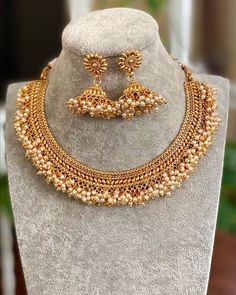 Gold Necklace/ Indian Jewelry/ Indian Necklace/ Adjustable Gold plated Pearl Necklace/ Indian Gold Necklace Set/ Indian Wedding Jewelry Gorgeous 22 K gold plated. Perfect for Indian weddings. Size- Adjustable All the raw material used in this product is of high quality and is handcrafted with love. Premium Quality and High craftsmanship 100% Satisfaction Guarantee: Long Lasting Plating, High-Quality Stones. Gifting: This pair of charming necklace and earrings come in a beautiful gift box, making Choker Necklace Indian Gold, Gold Choker Necklace Indian, Gold Necklace Set Indian, Indian Gold Necklace Set, Pearl Necklace Indian, Choker Necklace Indian, Guttapusalu Necklace, Choker Pearl Necklace, Indian Gold Necklace