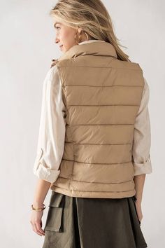 Embrace the changing seasons with our Quilted Puffer Vest in Khaki, a must-have addition to your wardrobe for both fashion and function. This vest combines cozy warmth with contemporary style, ensuring you look and feel your best as the temperature drops. Quilted Design: The Quilted Puffer Vest boasts a stylish quilted pattern that adds texture and visual appeal. This thoughtful design not only enhances its aesthetic but also provides an extra layer of insulation to keep you warm in colder weath Quilted Puffer Vest, Quilted Pattern, Style Upgrade, Cozy Chic, Changing Seasons, Puffer Vest, High Collar, Easy Wear, Quilting Designs