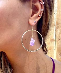 Gorgeous light weight large gold hoops with 100% real Amethyst stones. 14k gold plated lightweight hoops. Perfect boho chic look and February birthday gifts! Regular hoops- texture ridges Hammered hoops- beautiful rustic hand hammered detailing. Please see photo. 💜Amethyst crystals are potent stones to aid healing and they bring intense spiritual growth. ♥ Increases nobility ♥ Spiritual awareness ♥ Psychic abilities ♥ Inner peace and healing ♥ Healing of body, mind & soul ♥ Positive transfo Adjustable Gemstone Hoop Jewelry, 14k Gold Filled Dangle Hoop Earrings With Gemstone, Spiritual Style Single Dangle Earring, Adjustable Small Hoop Gemstone Jewelry, 14k Gold Filled Natural Stone Drop Earrings, 14k Gold Filled Gemstone Hoop Earrings, 14k Gold Filled Drop Earrings With Natural Stones, Nickel-free 14k Gold Filled Hoop Jewelry, Purple Bohemian Everyday Jewelry