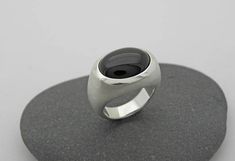 Elegant, simple silver ring with transversely aligned onyx in oval cabochon cut and beautiful dark black. Onyx oval 12 x 16mm All ring sizes are available. Please write your ring size in the comment field by checking out. On the following link, you will find the ring with a larger stone 20 x 15mm https://www.etsy.com/de/listing/228065410/grosser-onix-ring-in-silber-925?ref=shop_home_active_17 Modern Oval Cabochon Signet Ring As Gift, Modern Oval Cabochon Signet Ring For Formal Occasions, Modern Oval Cabochon Signet Ring For Gift, Minimalist Oval Cabochon Signet Ring For Formal, Minimalist Oval Cabochon Signet Ring For Formal Occasions, Modern Onyx Signet Ring With Polished Finish, Modern Oval Cabochon Signet Ring, Modern Oval Cabochon Dome Ring, Modern Sterling Silver Rings With Oval Cabochon