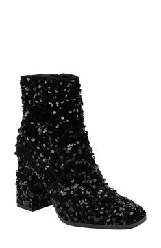 Paillettes catch the light from every angle on a richly textured boot featuring a cushioned footbed and dramatic block heel. 4" heel Synthetic upper/cotton lining/rubber sole Imported Glamorous Winter Boots With Sequins, Glamorous Winter Glitter Boots, Winter Heeled Boots With Stacked Heel For Night Out, Sequin Boots For Evening Parties, Sequined Boots For Evening Party Season, Sequin Boots For Evening And Party Season, Glitter Ankle Boots For Winter, Winter Glitter Ankle Boots, Party Platform Boots With Stacked Heel