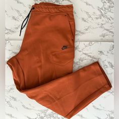 New/ Authentic Nike Sportswear Tech Fleece Utility Jogger Pants Bronze Style Dm6453-825 Men Size Xl Offers Welcomed Nike Sportswear Pants With Side Pockets, Nike Sporty Pants With Pockets, Nike Sporty Cargo Pants With Pockets, Nike Sporty Cargo Pants, Sporty Brown Pants With Pockets, Nike Athleisure Pants For Fall, Sporty Brown Pants For Gym, Nike Athleisure Cargo Pants With Cargo Pockets, Nike Cargo Pants With Side Pockets For Sports