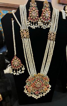 Experience the stunning beauty of our Noratan Mala, Earrings and Teeka Set. This extraordinarily gorgeous jewelry set seamlessly combines Indian and Pakistani design with precious gemstones, creating a timeless elegance. Handcrafted with intricate details, it symbolizes beauty and spirituality. Adorn your look with grace and sophistication, making a statement for any occasion. Explore our shop and immerse yourself in the enchanting allure of the Noratan Mala Set. Mala Design Jewellery, Mala Design, Pakistani Design, Wedding Jewellery, Gorgeous Jewelry, Wedding Jewelry Sets, Precious Gemstones, Intricate Details, Indian Wedding