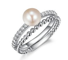 Showcasing a lustrous cultured freshwater pearl accented by shimmering stones and stacked together with a rhodium-plated band, this beautiful set elevates any look from office attire to your little black dress. Silver Pearl Rings With Diamond Accents, Silver Rings With Diamond Accents And Pearl, Elegant Stackable Party Jewelry, Elegant Adjustable Rings For Party, Formal Stackable Pearl Ring, Fine Jewelry, Formal Stackable Pearl Ring Fine Jewelry, Elegant Stackable Sterling Silver Pearl Ring, Elegant Sterling Silver Stackable Pearl Ring, Stackable Pearl Ring For Wedding