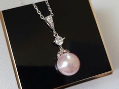 Wedding Light Pink Rosaline Blush Pink Pearl Drop Silver Bridal Pendant Necklace with .925 Sterling Silver Chain. CHAIN is 18 inches (45.7cm) long. PENDANT is about 1.13 inch (2.9cm) long including bail. MATCHING EARRINGS Pic.#7: https://www.etsy.com/listing/618167974/pink-pearl-earrings-blush-pink-pearl?ref=shop_home_active_19 BRIDAL NECKLACES SECTION: https://www.etsy.com/shop/LanaChayka?ref=seller-platform-mcnav§ion_id=11638944 BRIDAL JEWELRY SETS SECTION: https://www.etsy.com/shop/LanaChayka Pink Bridal Necklace For Anniversary, Pearl Pendant Bridal Necklace For Wedding, Pink Round Jewelry For Wedding, Pink Round Bridal Necklace For Anniversary, Elegant Blush Necklace For Gift, Elegant Pink Pearl Necklace For Anniversary, Pink Round Bridal Necklace Gift, Elegant Pink Bridal Necklace For Wedding, Formal Pink Bridal Necklace