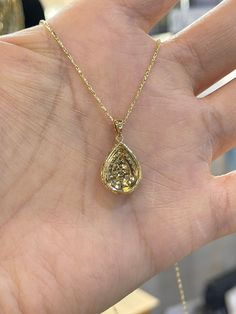 "Beautiful Pear Shape Diamond Necklace set in yellow gold. The diamonds are clear and very sparkling. Elegant and classy shape necklace. It's a nice size pendant, great to wear for any occasion. The diamond cut 14K Yellow Gold Chain has a nice sparkle to it and compliments the pendant perfectly. The chain is solid so it is strong. 18\" chain, let us know if you need a different length chain. Pendant length measures 22mm. The pear shape measures 16.2x12.5mm. Genuine Round Brilliant Cut Diamonds t Gold Diamond Necklace With Pearl Pendant, Luxury Pear-shaped Yellow Gold Diamond Necklace, Yellow Gold Pear-shaped Necklace With Rose Cut Diamonds, Yellow Gold Pear-shaped Rose Cut Diamond Necklace, Exquisite Gold Teardrop Pendant Necklace, Fine Jewelry Yellow Gold Pear-shaped Necklace, Fine Jewelry Yellow Gold Pear Necklace, Fine Jewelry 14k Gold Pear-shaped Diamond Necklace, Gold Teardrop Diamond Necklace With Vvs Clarity