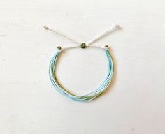 This fun bracelet is waterproof and great for anyone who is often doing outdoor activities. It would make a nice gift. Stack it with other bracelets, or wear it by itself! It is perfect for everyday wear! ∙ ∙ ∙ ∙ ∙ ∙ ∙ ∙ ∙ ∙ ∙ ∙ ◆ PLEASE NOTE ◆ When you first receive this bracelet it may be slightly sticky, which may make it more difficult to adjust. The stickiness does not last. After a day or two of wearing the stickiness will fade and it will be much easier to adjust. It will still be waterpr Bracelet Thread, Beachy Bracelets, Surf Bracelet, Bracelet String, Thread Bracelet, Surfer Bracelets, Fun Bracelet, Thread Bracelets, Bracelet Simple