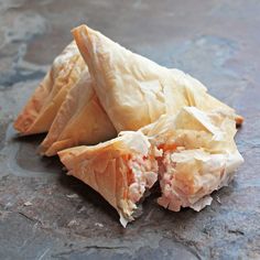 some kind of food that is on top of a table with blue and gray background