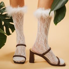 Be bold and stand out with these Destiny Feather Trim Lace Crew Socks! These raiment-ready beauties have the perfect amount of y2k vibes, and can pull up to mid calf or slouch, so you can 'flex' your style in any way you please. Semi-sheer nylon socks patterned in all-over crochet style lace. Hand-sewed feather trim just screams glam. Complete with a stretchy spandex cuff. So whether you're feeling more 'short and sweet' or edgy and elongated, these white aesthetic socks will take you straight t Aesthetic Socks, Wedding Socks, Slouch Socks, Nylon Socks, Crochet Style, Y2k Vibes, Feather Trim, Crew Sock, Sock Patterns