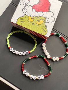 Christmas bracelet made to order.  Get ready for the festivities with these cute customizable bracelets. * Jolly AF * Grinch * Ho Ho Ho Please make sure to measure your wrist so you can get the best fit. You can take a piece of string and wrap it around your wrist , then measure it out against a ruler. Grinch Bracelet, Jolly Af, Holiday Bracelets, Diy Bracelets Tutorials, Christmas Bracelet, Ho Ho Ho, Bracelet Tutorial, Diy Bracelets, Grinch