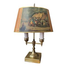 a lamp that has a painting on it