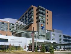 a large building with a superman statue in front of it