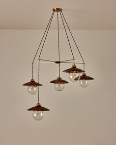 three lights hanging from the ceiling in a room