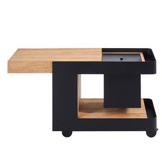 a black and wood table with an open drawer