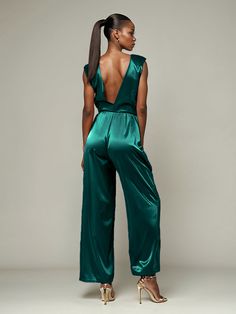 This soft satin jumpsuit features a flattering v-neck design, making it the perfect choice for mothers of the bride. Its dress pantsuit style provides comfort and elegance, while its high-quality material ensures a polished look. Stay stylish and comfortable on that special day with our jumpsuit. Dress Pantsuit, Formal Wedding Attire, Dress Pant Suit, Satin Jumpsuit, Peacock Green, Mother Of The Bride Dress, Different Fabrics, Mother Of The Bride Dresses, Polished Look