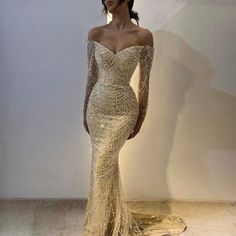 Introducing our Elegant Off-the-Shoulder Mermaid Luxury Dubai Evening Dress, a timeless and sophisticated choice for women attending weddings, parties, or formal events. This exquisite gown exudes opulence and grace, perfect for making a statement on any special occasion. Crafted with meticulous attention to detail, this dress features an off-the-shoulder neckline that elegantly frames the décolletage, while the mermaid silhouette accentuates the curves for a flattering fit. The long sleeves add Long Sleeve Prom Dress Mermaid, Formal Dresses Mermaid, Dubai Evening, Floor Length Prom Dresses, Mermaid Sequin, Long Sleeve Prom, Long Sleeve Dress Formal, Long Sleeve Evening Dresses, Dress 2024