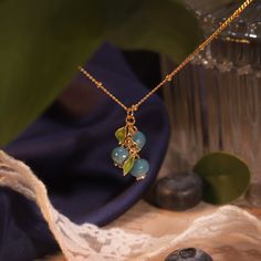 Add a burst of vibrant charm to your jewelry collection with the Blueberry Necklace, a delightful accessory that captures the essence of nature's bounty. This enchanting piece features a meticulously crafted blueberry pendant, adorned with rich enamel detailing that brings the fruit to life in stunning color. Made from durable brass and lavishly coated in 18K gold, the berry necklace combines luxurious style with lasting quality. Perfect for both everyday wear and special occasions, the blueberr Delicate Light Blue Jewelry Gift, Delicate Light Blue Jewelry For Gift, Elegant Turquoise Charm Necklace For Gift, Blue Jewelry With Flower Charm And Round Beads, Light Blue Round Beaded Jewelry For Gifts, Light Blue Pendant Necklace For Gift, Light Blue Pendant Necklace As Gift, Blue Flower Charm Jewelry As Gift For Her, Blue Pendant Jewelry With Delicate Chain