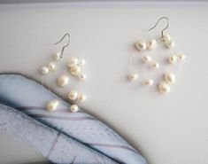 About the design:Selection of natural pearls to ensure quality, pure handmade, handmade meticulous improve the design texture.About the metal:Strengthened fishing line bead bonding process.100%Satisfaction guaranteed customer service.Thanks. White Pearl Chain Earrings With Round Beads, Minimalist Handmade White Pearl Earrings, Handmade Minimalist White Pearl Earrings, Handmade White Minimalist Pearl Earrings, Handmade Pearl White Pearl Earrings, Handmade Minimalist Pearl White Pearl Earrings, Baroque Earrings, Bridal Bouquet Peonies, Boho Wedding Bouquet