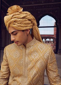 Step into elegance with this gold raw silk short sherwani, adorned with intricate resham and patra work. Paired with a satin kurta and dhoti, it comes with a stole. Gold Raw Silk Dupatta With Naqshi Detail, Festive Naqshi Traditional Dola Silk Wear, Gold Raw Silk Dupatta With Naqshi Embroidery, Gold Naqshi Raw Silk Dupatta, Gold Embroidered Dupatta For Traditional Ceremonies, Festive Gold Dupatta With Naqshi Details, Festive Gold Naqshi Dupatta, Traditional Silk Wear With Naqshi For Festivals, Silk Traditional Wear With Naqshi For Festivals