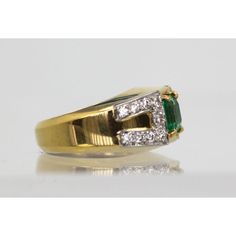 This is part of Chairish’s Fine Jewelry assortment.  This gorgeous David Webb Emerald and Diamond ring comes out of Paris and it is stunning. The ring features a gorgeous true Emerald Green Emerald square cut stone of approximately 1.25 to 1.50 carats and 18 Diamonds totaling approximately 0.90 carats. Metal: 18K Yellow Gold Weight: 13.8 Grams Stone: Square cut Emerald 1.25-1.50 Carats Stones:18 Diamonds .90 carats Size: 5-6 w/inner guard Dimensions: size 5-6.  This ring is double stamped Webb, Classic Emerald Ring With Princess Cut Diamond, Luxury Emerald Cut Gemstones For Anniversary, Square Cut Emerald Ring With Diamond For Promise, Classic Emerald Diamond Ring With Accent Stones, Diamond Baguette Cut Birthstone Ring, Emerald Cut Diamond Gemstone For Formal Occasions, Emerald Cut Diamond Gemstones For Formal Events, Yellow Gold Square Cut Ring With Diamond Accents, Formal Emerald Cut Diamond Gemstone