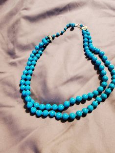 Turquoise Blue or Bright Blue, 18-inch Dual Strand Necklace, Costume Jewelry, Fashion Accessory, Gold Toned Hook, Made in Japan This is a great find and very collectible.  The measurement is on the bottom strand. Check out our shop for monthly specials. We have a variety of items for every taste. Combine several of our items together to save on shipping. If you have any questions please do not hesitate to ask. I will ship outside of the US, just request a quote. Happy Shopping. I will work aroun Adjustable Double Strand Turquoise Blue Necklace, Adjustable Double Strand Blue Turquoise Necklace, Elegant Blue Turquoise Necklace With Round Beads, Blue Beaded Turquoise Costume Jewelry Necklace, Beaded Blue Turquoise Costume Jewelry Necklace, Beaded Blue Turquoise Costume Necklace, Blue Single Strand Costume Jewelry, Elegant Double Strand Blue Turquoise Necklace, Mode Crochet