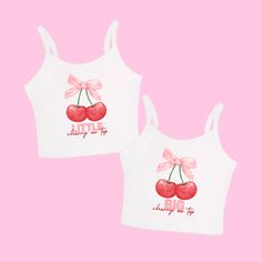 two white tank tops with cherries on the front and pink bow at the back