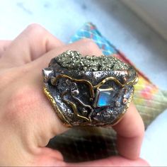 What A Stunning Statement This Ring Makes! Marked David Godinez For San Miguel Artisan Who Created It Marked 925 For Sterling Silver Large Pyrite Center Surrounded By Crown Of 2 Square Moonstones And 2 Citrines Has A Brutalist Style, Condition Is Euc, Barely Worn & Kept Safe. Will Be Cleaned Before Sent Like All Jewelry And Comes In A Gift Box. Measures 8-9 On Ring Sizer. Very Comfortable To Wear & Well Made If You Have Any Questions Please Ask Artisan Crystal Gemstone Ring, Multi-stone Moonstone Opal Ring For Gifts, Moonstone Multi-stone Opal Ring As Gift, Fusion Style Moonstone Ring Gift, Unique Opal Ring With Moonstone, Unique Moonstone Ring With Gemstone Accents For Anniversary, Fusion Style Moonstone Gemstone Ring For Anniversary, Fusion Style Anniversary Moonstone Gemstone Ring, Handmade Fusion Style Moonstone Ring As Gift