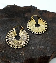 HANDMADE Beautiful Mandala hoop earrings. Ideal for everyday wear or for a special bohemian look. SIZE Aprox Length: 4.6 cm Aprox diameter: 3.8 cm Handmade with high quality hypoallergenic Jewelery brass, nickel free. LINK Please follow the link to view my shop for other beautiful pieces. https://www.etsy.com/uk/shop/JagathaStudio Festive Brass Hoop Earrings With Ear Wire, Festive Oxidized Finish Hoop Earrings, Festive Handmade Brass Hoop Earrings, Festive Round Hoop Earrings With Oxidized Finish, Adjustable Festival Hoop Earrings With Ear Wire, Nickel-free Hoop Earrings For Festivals, Bohemian Round Metal Plug Earrings, Bohemian Round Brass Plug Earrings, Vintage Gold Hoop Earrings For Summer