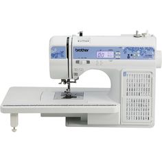 the brother sewing machine is white and has blue accents on it's front panel