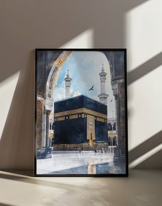 a painting of the ka'bah is shown in front of a white wall