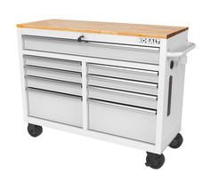 a white tool cabinet with drawers on wheels and a wooden cutting board in the middle