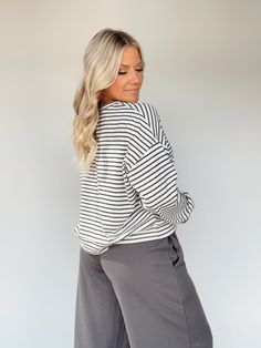 Feel elevated and sophisticated in our Another Coffee Striped Top, a stylish take on a classic design. This timeless striped top features a rounded neckline and a relaxed fit for maximum comfort. Soft and stretchy, it's perfect for lounging or a brunch date. Enjoy versatile style for any occasion, from work to school to errands. Sophisticated, cozy, and chic – you can't go wrong! 58% Cotton 34% Polyester 8% Spandex Hand wash cold. Oversized Top With Striped Hem, Chic Striped Hem Top For Fall, Oversized Tops With Striped Hem For Spring, Vertical Stripes Long Sleeve Top For Day Out, Spring Oversized Top With Striped Hem, Oversized Spring Top With Striped Hem, Oversized Striped Hem Tops For Spring, Fall Striped Hem Top For Loungewear, Vertical Stripes Relaxed Fit Top For Day Out