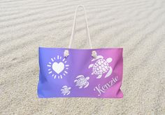 a purple bag sitting in the sand on top of a beach with sea turtles and sunbursts