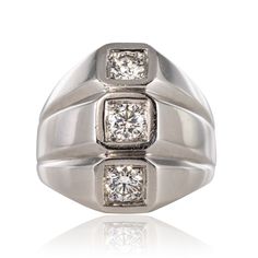 Ref. : 20-203 Ring in 750 thousandths 18K white gold, owl hallmark. Ring inspired by models by Jean Desprès, it is composed of three flat rings contiguous to each other, each set on top of a modern brilliant-cut diamond. On the back, the settings are openwork with small hearts. Total diamond weight: approximately 0.60 carat. Height: 17.9mm, Width: 16.2mm, Thickness: 5.3mm Approx, Ring Width at Base: 4.2mm. The jewel weighs: approximately 10.5 g. Authentic antique jewel - Work of the 1950s.  Our White Gold Three Stone Platinum Rings, Platinum Three Stone White Gold Rings, Platinum White Gold Three Stone Rings, Formal Silver Diamond Signet Ring, Silver Diamond Signet Ring For Formal Occasions, White Gold Three Stone Platinum Diamond Ring, White Gold Platinum Signet Ring With Brilliant Cut, Platinum White Gold Signet Ring With Brilliant Cut, Platinum Silver Signet Ring With Diamond Accents