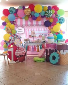 an ice cream shop decorated with balloons and decorations