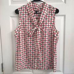 Nwt Talbots Sleeveless Shell Secretary Bow Blouse. Button Front. Color - Cream Color Blouse With Red And Black Dot And Dash Design. Size: 10 Approx Measurements Laid Flat: Armpit To Armpit: 20-1/4” Bottom Width: 21-1/2” Shoulder To Bottom Hem: 100% Polyester Smoke Free Home Retro Red Sleeveless Tank Top, Sleeveless Office Top With Button Closure, Casual Sleeveless Blouse For Office, Casual Sleeveless Office Blouse, Sleeveless Tops With Button Closure For Work, Casual Sleeveless Top For Office, Red Sleeveless Retro Vest, Retro Red Sleeveless Vest, Casual Sleeveless Vest For Office