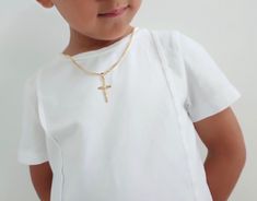 Children's Gold Cross Necklace, Gold Kids Dainty Cross Necklace, Baptism Gift for Him,  Toddler Baby Boy, Cross Unisex Cross ---------------------------------------------------------------------------------------- ♥ It comes packaged ready for gift giving :).  ♥ DETAILS - Material: 18k Gold Filled  - Nickel free hypoallergenic for sensitive skin - Lightweight, perfect for everyday wear ♥ SHIPPING  All orders will be shipped out within 1 business days after the order has been received. Orders shipped to the US take 2-4 business days to arrive. Canadian orders take about 7-14 business days to arrive. All other international orders take 7-21 business days to arrive.  ♥ GIFTS If you would like us to send the jewelry directly to the recipient, all you need to do is to put down the recipient add White Cross Necklace For Baptism, White Cross Pendant Necklace For Baptism, White Crucifix Necklace For Baptism, Cross Necklace Gold, Dainty Cross Necklace, Toddler Baby Boy, Boys Necklace, Gold Cross Necklace, Orders Shipped