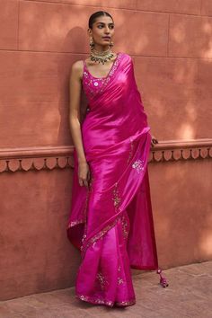 Rani pink saree with bloom patra border embroidery. Paired with sleeveless square neck blouse with all over floral patra embroidery.
Components: 2
Pattern: Embroidery
Type Of Work: Patra
Neckline: Square
Sleeve Type: Sleeveless
Fabric:  Organza Silk, Chanderi Silk
Color: Pink
Other Details: 
Note: The outfit worn by the male model and blouse worn by the celebrity is not for sale
Occasion: Wedding, Sangeet - Aza Fashions Sleeveless Silk Saree For Wedding, Sleeveless Silk Blouse Piece With Mirror Work, Sleeveless Pre-draped Saree For Diwali, Summer Bollywood Pre-draped Saree, Sleeveless Summer Festive Pre-draped Saree, Summer Festive Sleeveless Pre-draped Saree, Pink Sleeveless Saree For Navratri, Pink Pre-draped Saree For Summer, Summer Zari Work Pre-draped Saree