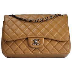 This Chanel Double Flap Bag is made with smooth supple lambskin leather in a caramel color. Featuring dark sliver toned hardware, a metal chain interlaced with leather, an interlocking CC turn lock clasp, and a half moon back slip pocket. The interior is lined in leather with the "love letter” zipper pocket under the front flap, an outer slip pocket under the internal flap, and a large open interior with two pockets separated by a lipstick compartment. Chanel bags with the serial number 20XXXXXX Luxury Quilted Women's Flap Bag, Luxury Brown Flap Bag, Luxury Camel Shoulder Bag With Leather Lining, Luxury Caramel Shoulder Bag With Detachable Strap, Luxury Brown Flap Bag With Leather Lining, Luxury Caramel Top Handle Shoulder Bag, Luxury Camel Bag With Detachable Strap, Luxury Caramel Top Handle Bag, Luxury Caramel Leather Shoulder Bag