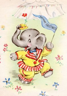 an elephant in a yellow outfit holding a blue flag with the words happy birthday written on it