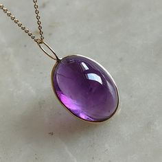 This stunning Pendant is set in 14k Solid Yellow Gold with Natural Purple Amethyst with utmost precision. It is a unique gemstone Pendant for nearly every occasion and is completely hassle-free jewelry. ITEM DETAILS: * Gem: Purple Amethyst * Gem Size: 15x20mm * Gem Shape: Oval Fix Loop * Gem Weight: 18.60 carats * Gold Purity: 14KT  * Gold Weight: 0.41 gram * Total Weight of the Pendant: 4.13 gram The Gold purity is guaranteed and it comes with authentic 14KT gold hallmark. Since my items are ha Timeless Amethyst Jewelry Gift, Formal Amethyst Jewelry With Polished Finish, Purple 14k Gold Fine Jewelry Gemstones, Classic Yellow Gold Amethyst Gemstone, Amethyst 14k Stamped Jewelry For Gift, Amethyst Jewelry Stamped 14k Gift, 14k Stamped Amethyst Jewelry Gift, Timeless Round Purple Jewelry, Timeless Purple Round Jewelry