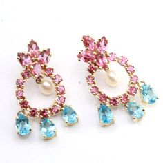 This Exquisite Earrings Is Crafted From 14k Gold And Mounted With Pink Tourmalines In Round And Pear Shapes Cut, Blue Topaz In Beautiful Colors Added With Freshwater Pearl In The Center. It Is Marked 14k And Mei At The Back. It Excellent Condition. Colors Are In Magnificent Contrasting Combination Giving A More Fun And Flirty Look To This Set. Measures 1 1/2" By 7/8" And Weighs 10 Grams. 1c2201-2-14 Blue Pearl Earrings, Pear Shapes, Pearl Chandelier Earrings, Blue Pearls, Pearl Chandelier, Pearls Earrings, Blue Pearl, Earrings Color, Pink Tourmaline