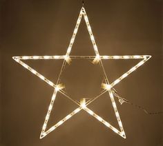 a lighted star hanging from the ceiling