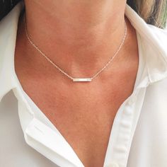 Delicate, minimal necklace with small bar. Personalize yours with meaningful inscription names, date or initials and choose from hammered or shiny finish. Make this necklace your everyday favorite or give as a gift. MATERIALS & ENGRAVING  ------------------------------------ * Bar: Tiny 3mm x 20mm  * Material: 14k Gold Filled, 925 Sterling Silver * Chain: Cable     * Engraving: fits up to 10 characters ~ UPPERCASE letters only   MEASURE YOUR PERFECT NECKLACE SIZE ---------------------------------------------------------- 1. If you are not sure of your size, wrap a string or phone charging cable around where you would like the necklace to sit and mark the length. 2. Measure this length in inches on a ruler. LINK TO MATCHING BRACELET ------------------------------------------ https://www.ets Minimalist Sterling Silver Bar Necklace With Rectangular Pendant, Minimalist Silver Bar Necklace As Gift, Dainty Sterling Silver Name Necklace For Everyday, Silver Minimalist Name Necklace For Birthday Gift, Silver Minimalist Name Necklace For Birthday, Minimalist Silver Name Necklace For Birthday, Silver Minimalist Name Necklace, Minimalist Sterling Silver Name Necklace For Everyday, Dainty Sterling Silver Bar Necklace For Everyday