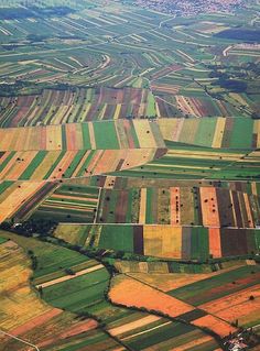 an aerial view of farmlands and fields in the country