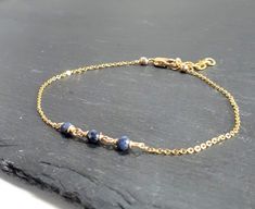 This beautiful handmade anklet features 3 Genuine Blue Sapphire gemstones wrapped in the metal of your choice. Dainty, minimal, and elegant, this bracelet is the perfect finishing touch to any style or event. Makes a great gift to add to any gemstone lover's collection. Perfect to gift for Christmas, Valentine's Day, Mother's Day, and more! Gemstone: Sapphire Gemstone Size: 3.0 mm Gemstone Shape: Rondelle, Faceted Metal: 14k Gold Filled or Sterling Silver (Nickel Free) Anklet Length: 9 inches (m Elegant Blue Anklets For Gifts, Elegant Blue Anklets For Gift, Minimalist Handmade Anklet As Gift, Dainty Handmade Anklets As Gift, Dainty Handmade Anklets For Gifts, Minimalist Handmade Anklet For Gift, Dainty Handmade Anklets For Gift, Handmade Minimalist Anklet For Gift, Handmade Dainty Anklets As Gift